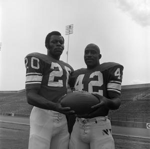 Two football players holding a ball, 4