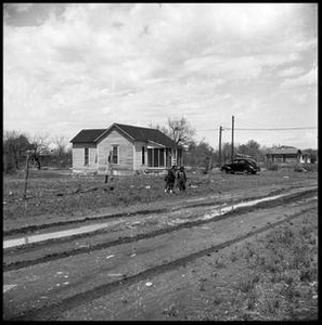 Children by a Muddy Dirt Road