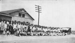 A group of colored children in front of a portable school building in a northern city