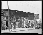 Vicksburg Negroes and shop front. Mississippi