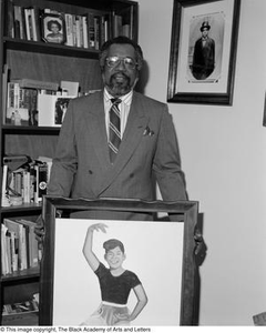 Photograph of Abner Haynes posing with painting of daughter