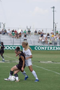 Tiffany Adams attempting to get the soccer ball