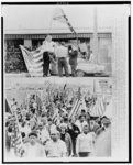 [Composite of two photographs: lower photograph shows the Selma--Montgomery civil rights march, with Dr. Martin Luther King, Jr., (front/center), Coretta Scott King (behind Dr. King) and John Lewis (right of Mrs. King); upper photograph shows five white segregationists, two with confederate flags]