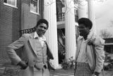 Sheriff Prince Arnold speaking with another man in front of the Wilcox County courthouse in Camden, Alabama.