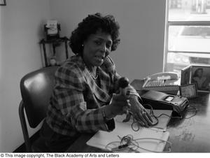 Photograph of Johnnye T. Hughes with her tape recorder