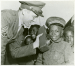 James Edward Sommerville watches Sgt. Arthur Dertrom demonstrate the Army's "handie-talkie" during the stopover of the WAC [Women's Army Corps]- War Bond Caravan in Cartersville, Ga., in the Fourth war Loan Drive