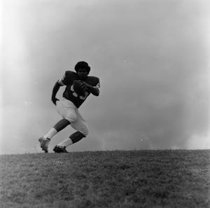 Football player running with the ball, 37