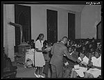 Giving presents to the graduates at the graduation exercises. Union Point Negro high school. Union Point, Greene County, Georgia