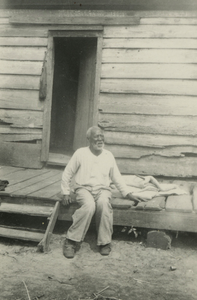 Male Gullah informant sitting on porch