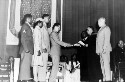 Awarding of Certificate of Merit to Virginia Statesmen in the Armed Services. Commencement exercises Virginia State College. Reading from left to right: Sgt. David Goodwyn, 1st Lt. Minnie Patterson, 2nd Lt. Robert Weaver, Captian Melvin T. Jackson, Dr. J.A. Moore, President L. H. Foster, Brig. General George A. Horkan