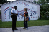 Student conversing with security guard