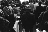 Several photographers and members of the press in the street at Martin Luther King, Jr.'s funeral.