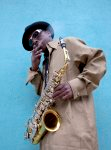 Herbert Bernett enjoys a smoke as he rests between playing jazz on his sax in Mobile, Alabama