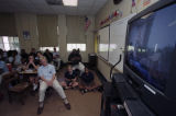 High School students in Mobile, Alabama, watching news coverage of the terrorist attacks on September 11, 2001.