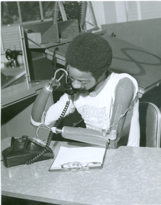 Thumbnail for Photograph of a double amputee using his prosthesis to dial a telephone at the Georgia Warm Springs Foundation, Warm Springs, Meriwether County, Georgia, 1965-1975