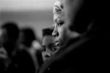 Young woman waiting to receive a bag of food from the Alabama Action Committee at Bell Street Baptist Church in Montgomery, Alabama.