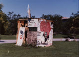 Image of signs, protests and displays put together by the SAA group on the University of Utah campus during political activity of the worldwide community to put an end to segregation in South Africa.