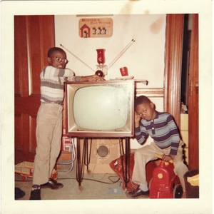 David and Stephen Hunter pose near a television set