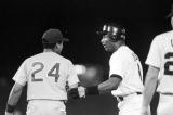 Bo Jackson talking to a player on the opposing team during a Birmingham Barons baseball game in Birmingham, Alabama.