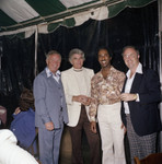 Donald Bohana posing with guests at an outdoor event, Los Angeles