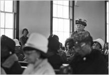 Woman standing in the audience during a program at Hall Street Baptist Church in Montgomery, Alabama.