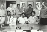 James Compton with beer company employees