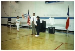 Woman Receiving Award at Annual Salute to Youth Awards Program