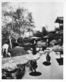 Two Japanese women in garden at Louisiana Purchase Exposition