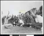 Youth stretching on playing field, Los Angeles, ca. 1951-1960