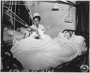 "Lt. Florie E. Gant...tends a patient at a prisoner-of war hospital somewhere in England."