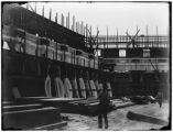 Applying staff to the walls in the Electricity palace courtyard