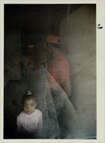 Thumbnail for Felicia and Bobbie Lowe stand in the family's doorway, November 21, 1991