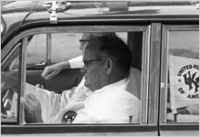Two Klansmen in a car at a Ku Klux Klan rally in Montgomery, Alabama.