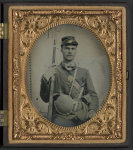 [Unidentified soldier in Union uniform with musket, pistol, knife, and canteen]