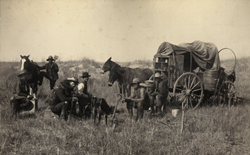 Cowboys around a chuck wagon