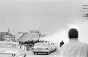 Alabama state police releasing tear gas on civil rights marchers crossing the Edmund Pettus Bridge in Selma, Alabama, on Bloody Sunday.