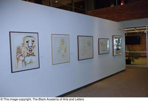 Photograph of an African gallery wall, featuring five art works