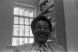 John Blassingame: New York. John Blassingame seated in office, Fredrick Douglas portrait on the wall (BLJP 1-79 #101)