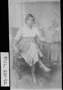 Photograph of Marian ____ talking on telephone, Atlanta, Fulton County, Georgia, 1913