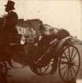 Joseph Wheeler with another man in a carriage during a parade.