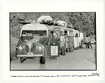 Caravan with "Silver" gearing up for Hog Farm show at Los Alamos atomic proving grounds at Black Horse Mesa, NM. 1968