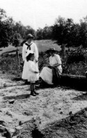 Two unidentified women and a little girl. Perhaps Corinne Davis and her daughter Helen