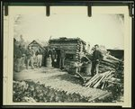 [Civil War camp of the 6th N.Y. Artillery at Brandy Station, Virginia, showing Union soldiers in front of log company kitchen]