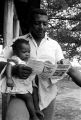 Man looking over a brochure for a political candidate before election day in Lowndes County, Alabama.