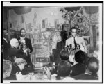 [Malcolm X, half-length portrait, facing right, at microphones, addressing newsmen at the Hotel Park-Sheraton in New York]