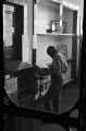 Student using a dictionary in the library of the Alabama Industrial School for Negro Children in Mount Meigs, Alabama.