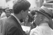 Julian Bond speaking to a man standing on a street in downtown Atlanta, Georgia, during the Democratic National Committee's regional conference, "Victory '68."