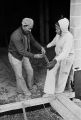 Plumbers William Merriweather and Margaret Alexander working at a job site on Barclay Drive in Bessemer, Alabama.