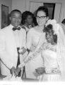 Susie Sanders Hubbard and her new husband, Freddie, cutting a cake in her parents' home in Montgomery, Alabama, during their wedding reception.