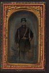 [Unidentified soldier in Union frock coat and forage cap with saber and musket]